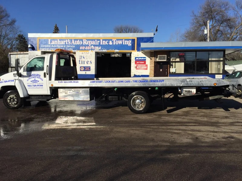 Lanhart's lettered tow truck parked outside the shop